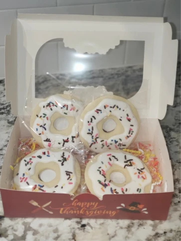Decorated cookies in a bakery box