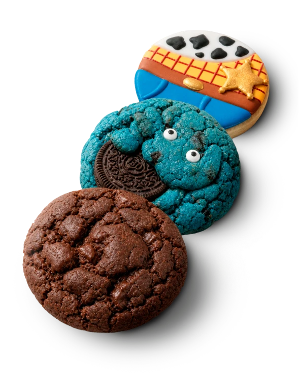 Stacked custom decorated cookies including cowboy, monster and chocolate cookies
